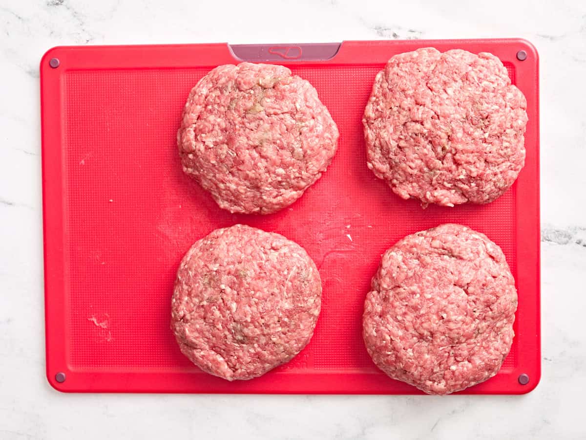 Formed cheese stuffed burger patties.