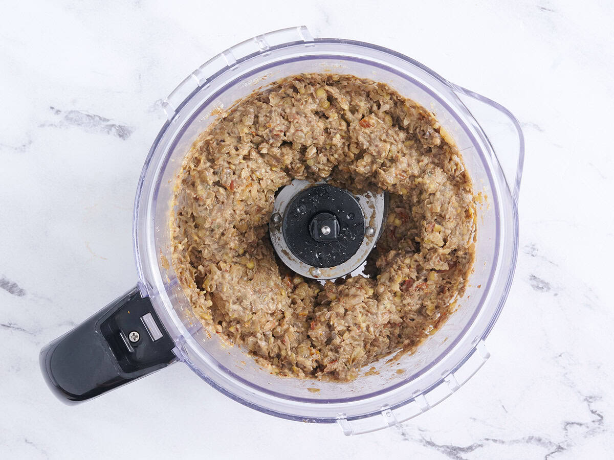 Vegetarian meatball mixture in a food processor.