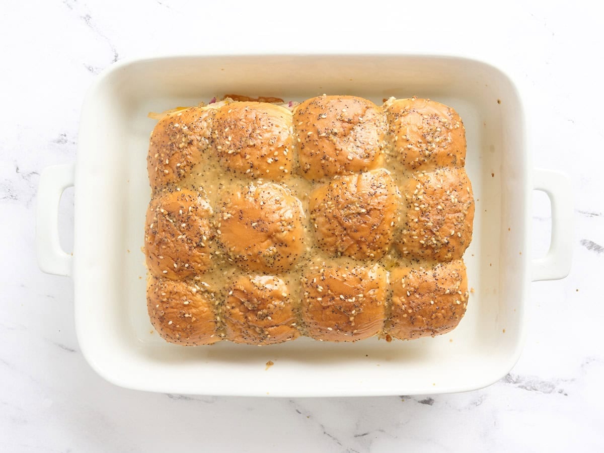 Chicken sliders in a baking dish fresh out of the oven.