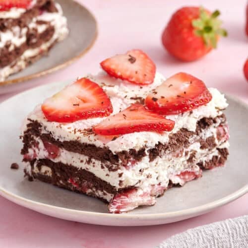 Side view of a slice of chocolate strawberry icebox cake.