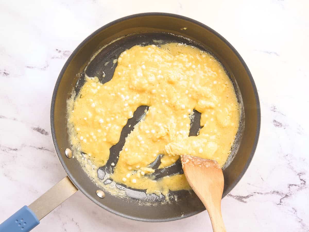 Cottage cheese eggs being cooked in a skillet.
