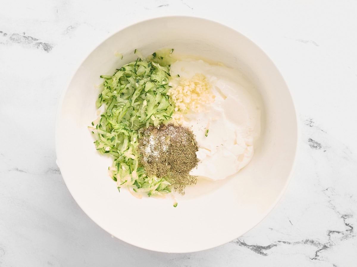 The ingredients for tzatziki in a bowl.