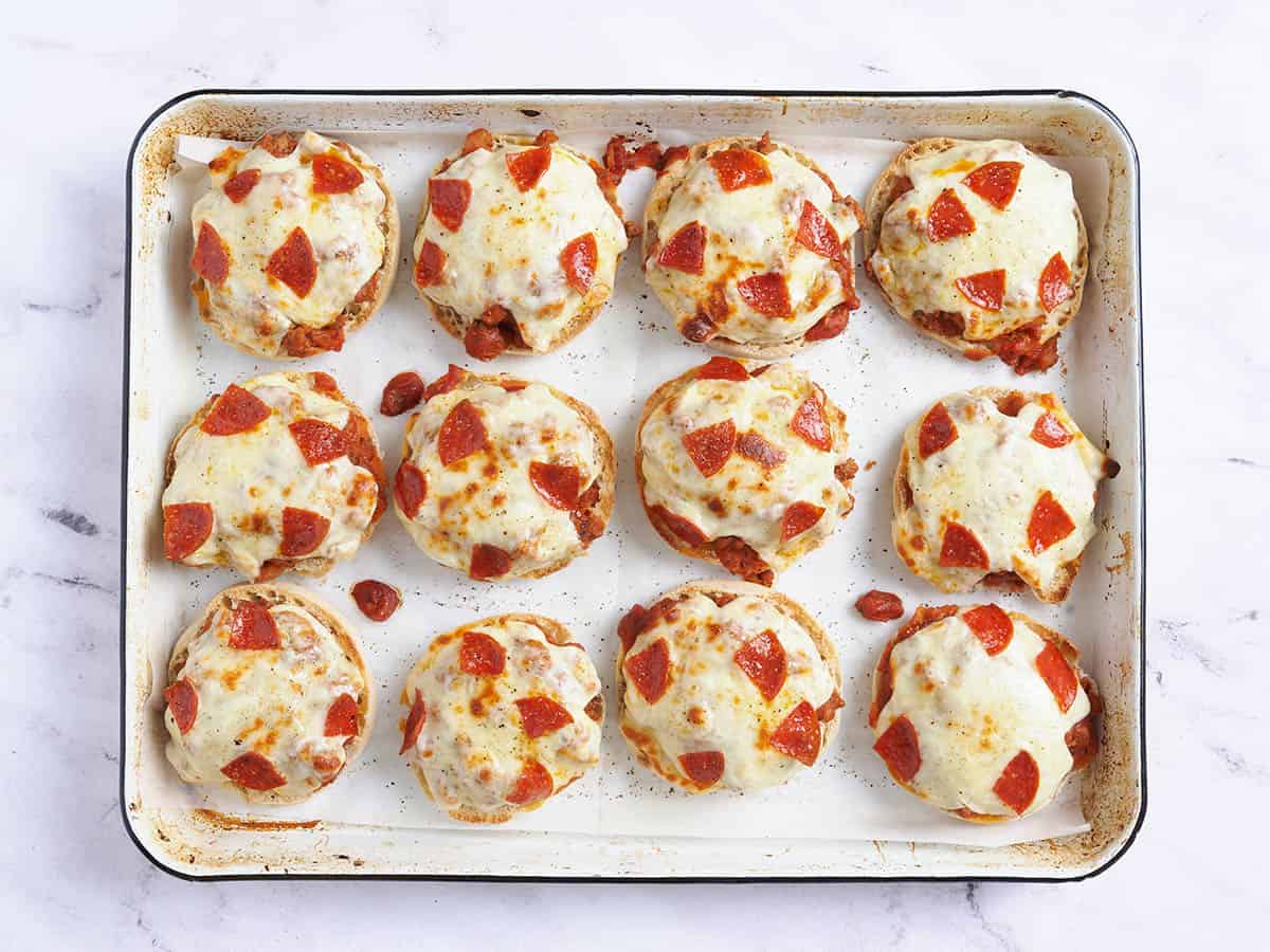 Finished pizza burgers on a baking sheet.