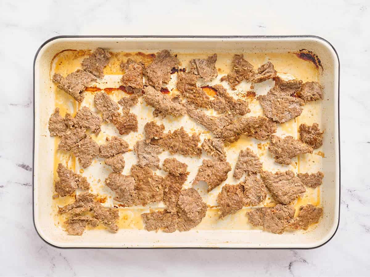Sheet pan doner kebab meat on a sheet pan before broiling.