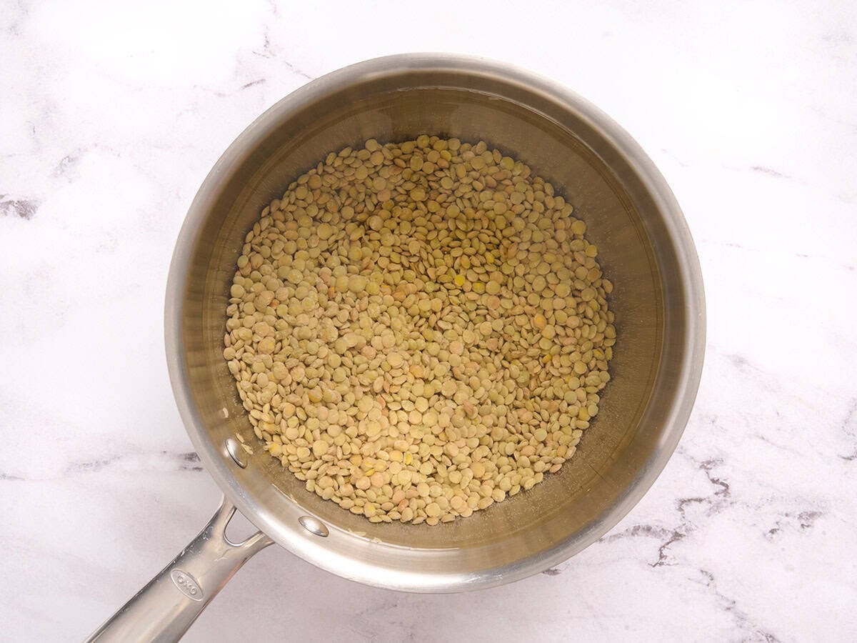 Lentils cooking in a saucepan.