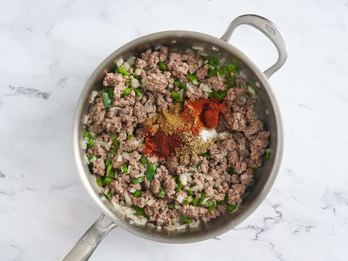 Taco seasoning added to browned ground beef.