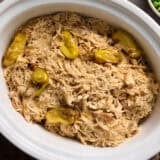 Overhead view of a crockpot of Mississippi chicken.