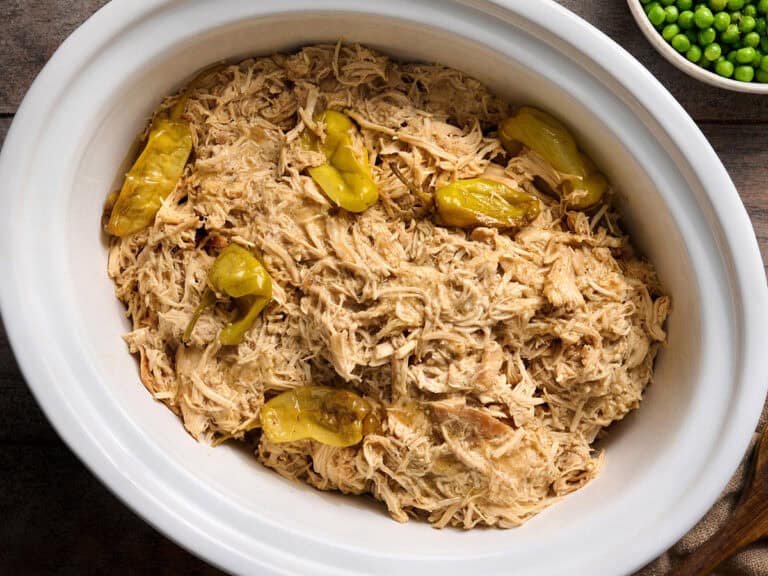 Overhead view of a crockpot of Mississippi chicken.