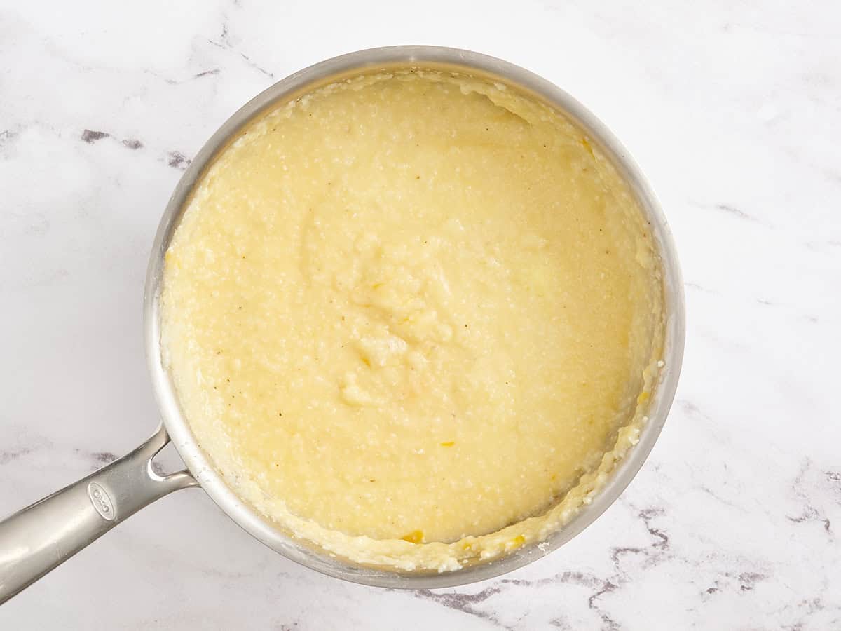 Cheesy grits in a skillet.