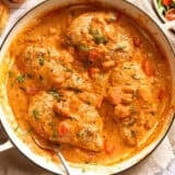 Overhead view of a creamy tomato chicken skillet.