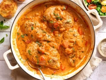 Overhead view of a creamy tomato chicken skillet.
