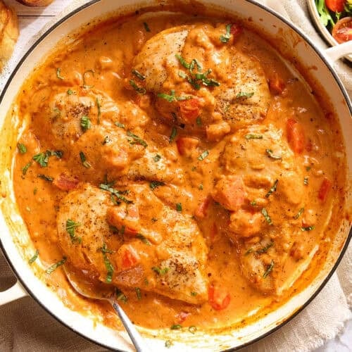Overhead view of a creamy tomato chicken skillet.