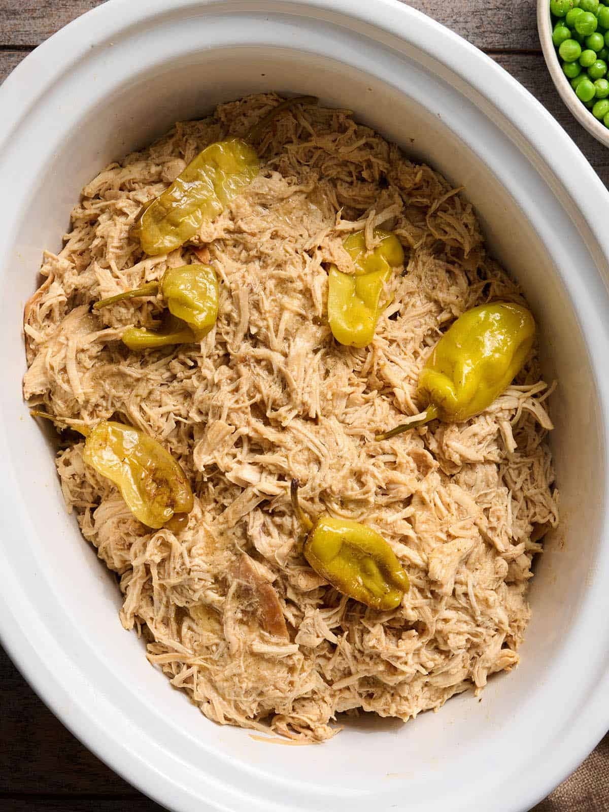 Overhead view of a crockpot of Mississippi chicken.