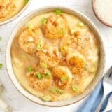 Overhead view of a bowl of shrimp and grits.