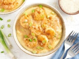 Overhead view of a bowl of shrimp and grits.