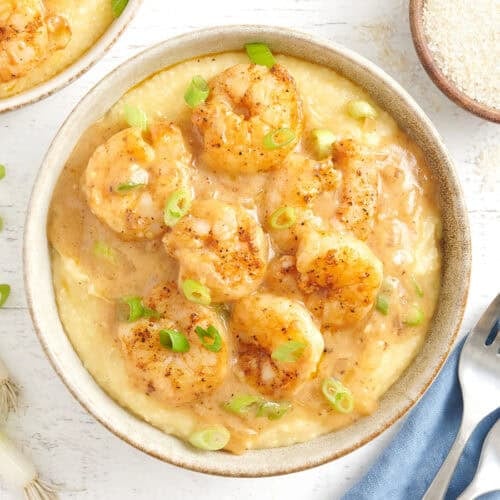 Overhead view of a bowl of shrimp and grits.