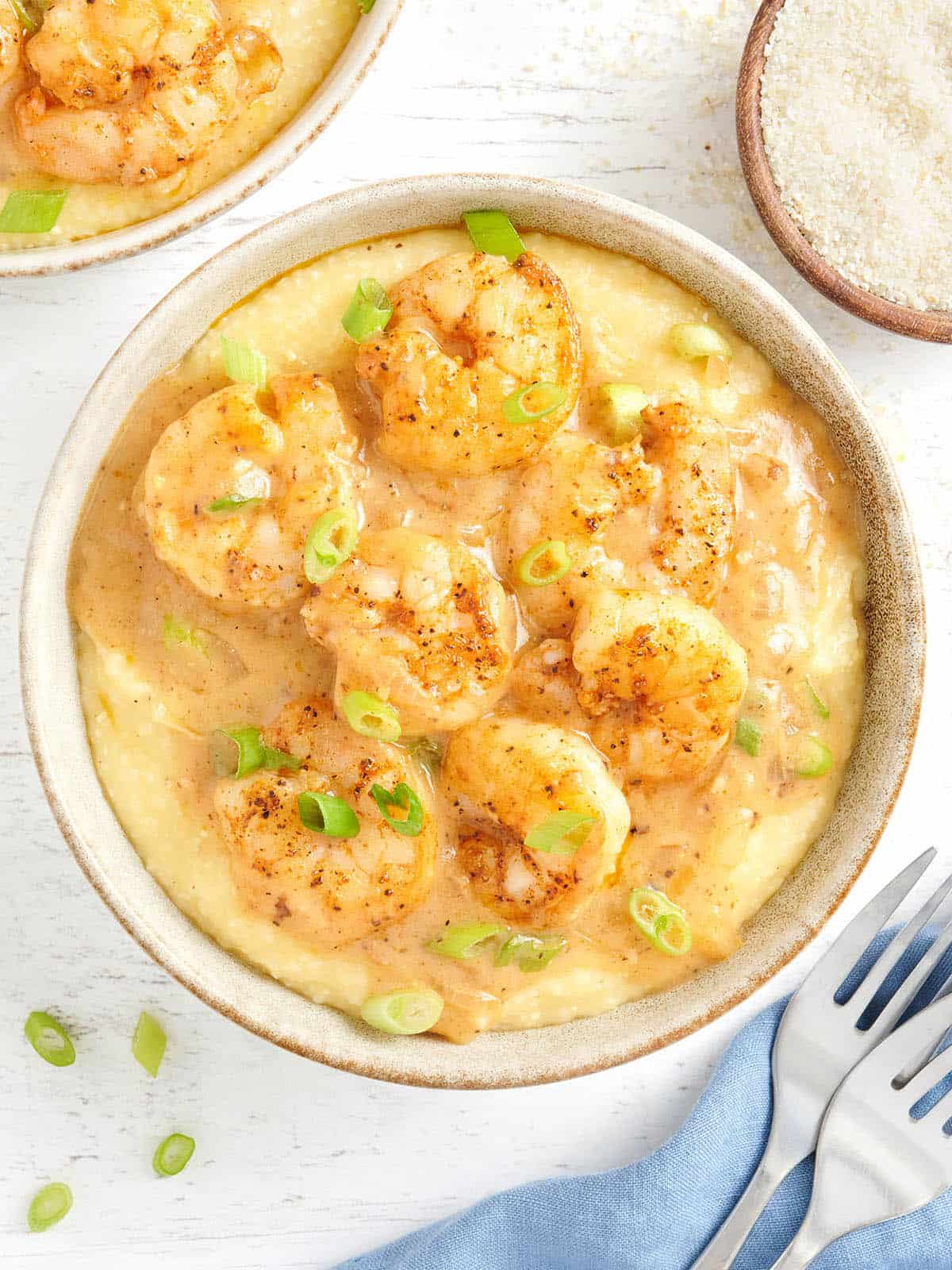 Overhead view of a bowl of shrimp and grits.