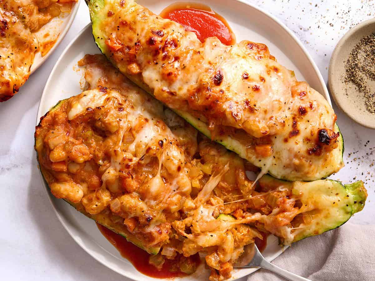 Tuscan white bean stuffed zucchini plated