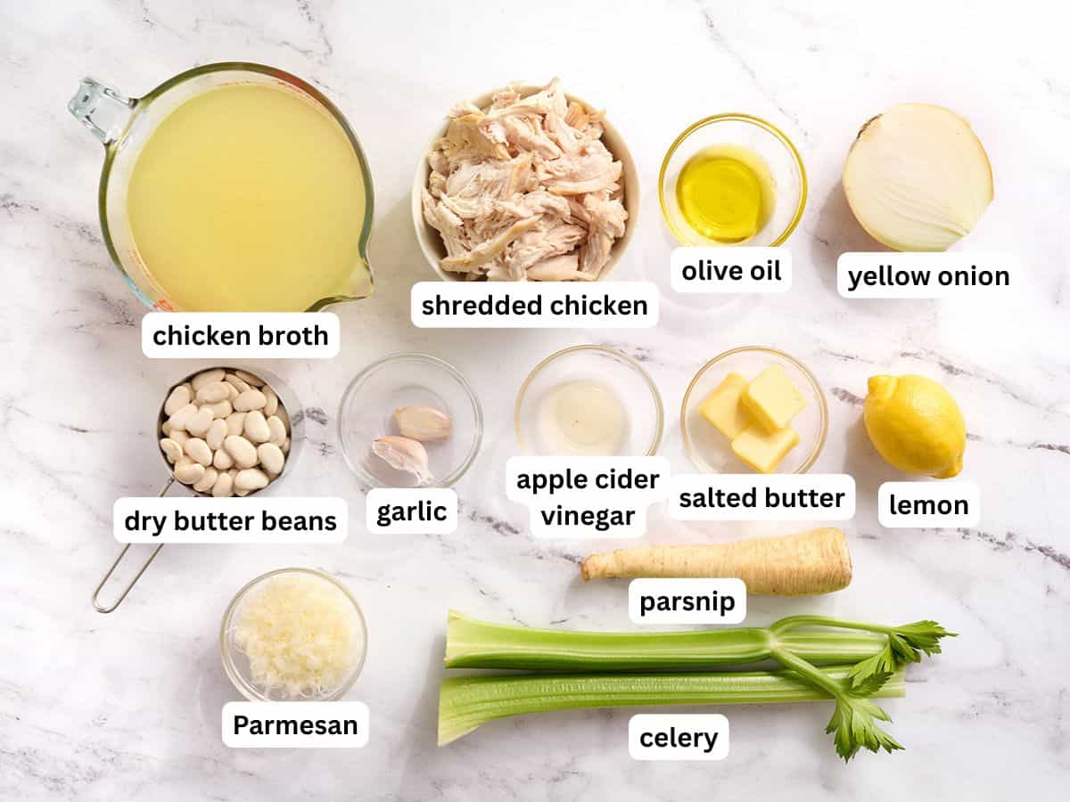 The ingredients to make a chicken white bean stew with labels.