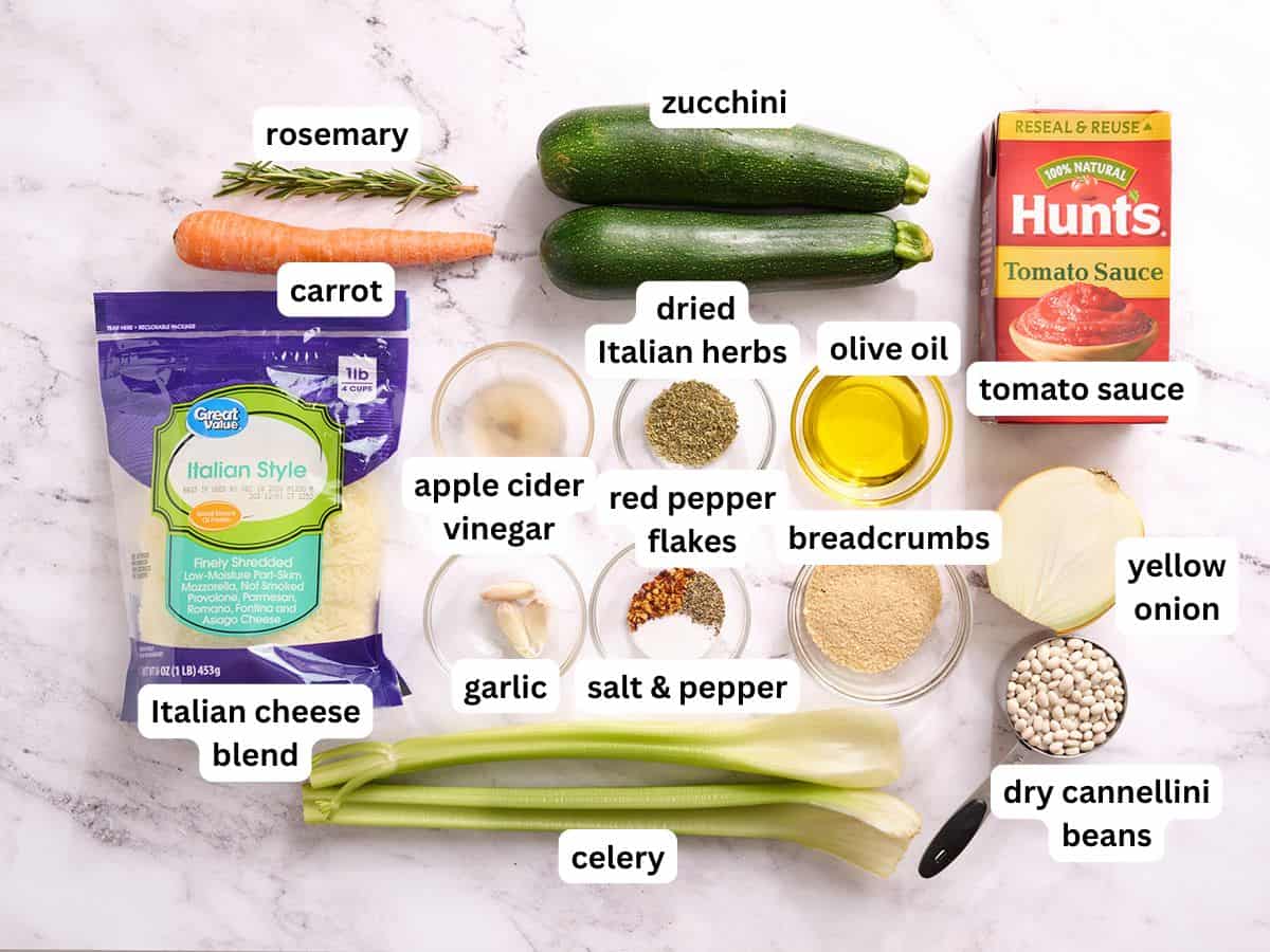 The ingredients to make tuscan white bean stuffed zucchini with labels.