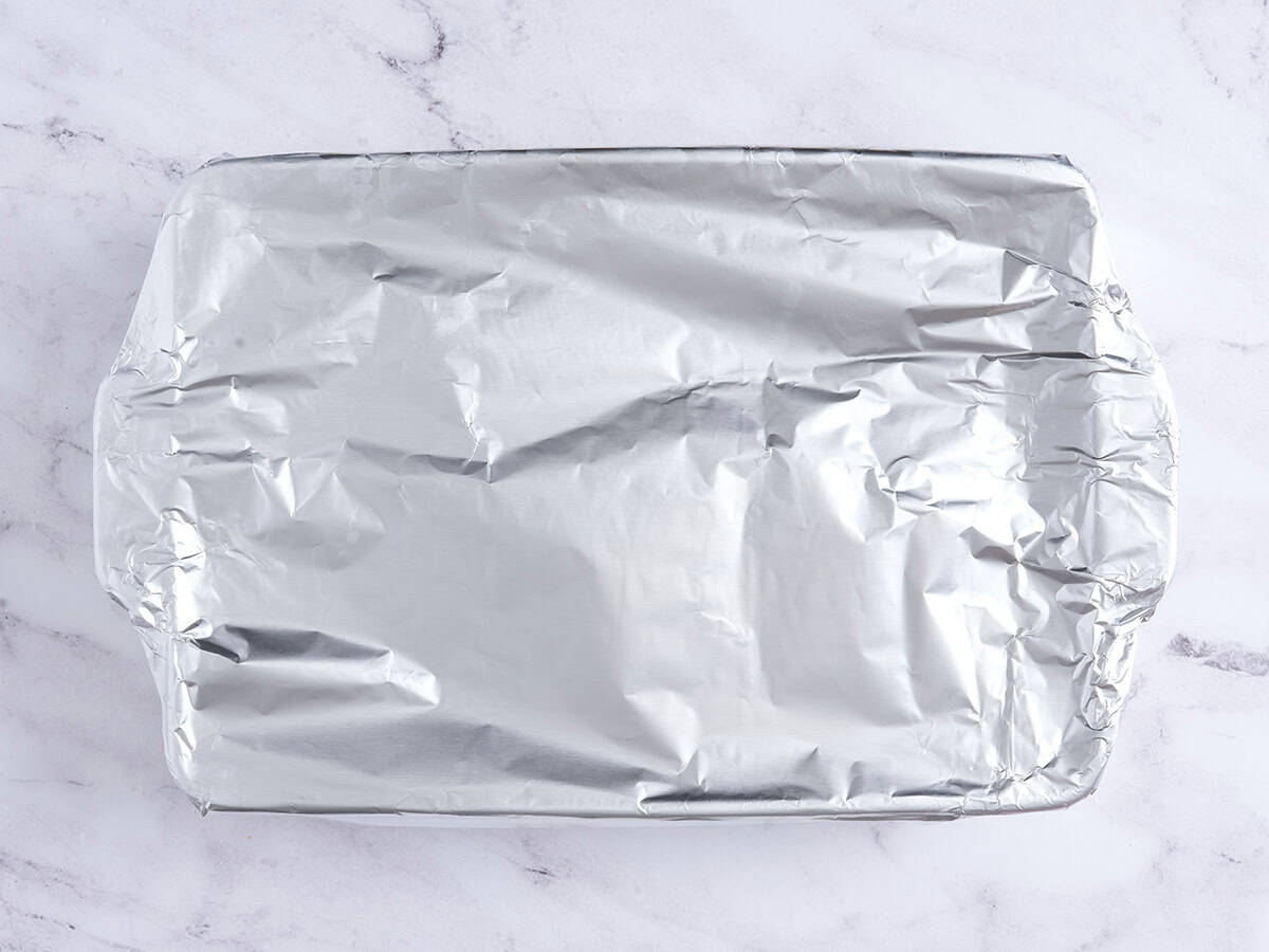 A baking dish covered with foil.