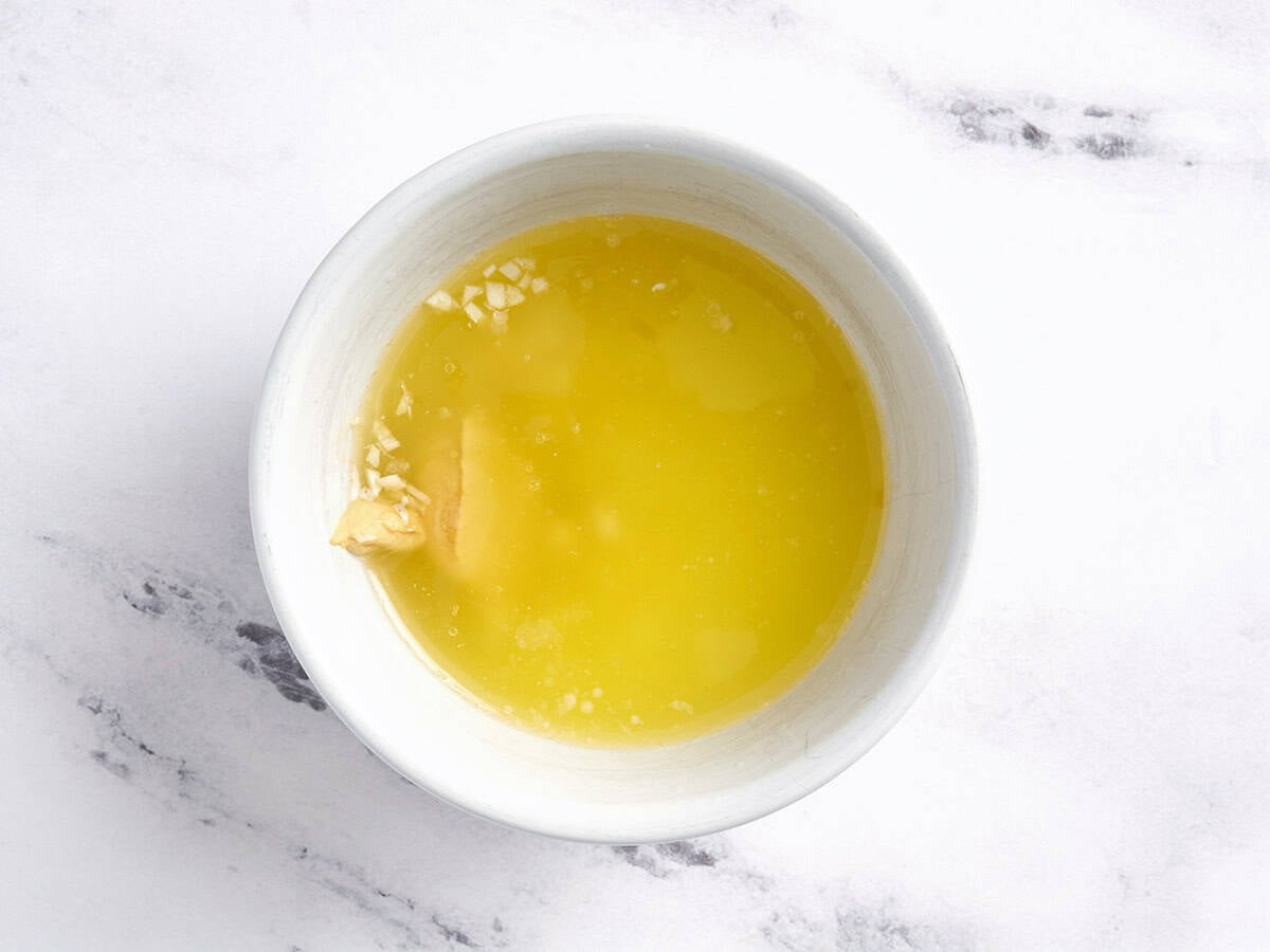 Melted butter, maple syrup and Dijon mustard in a bowl.