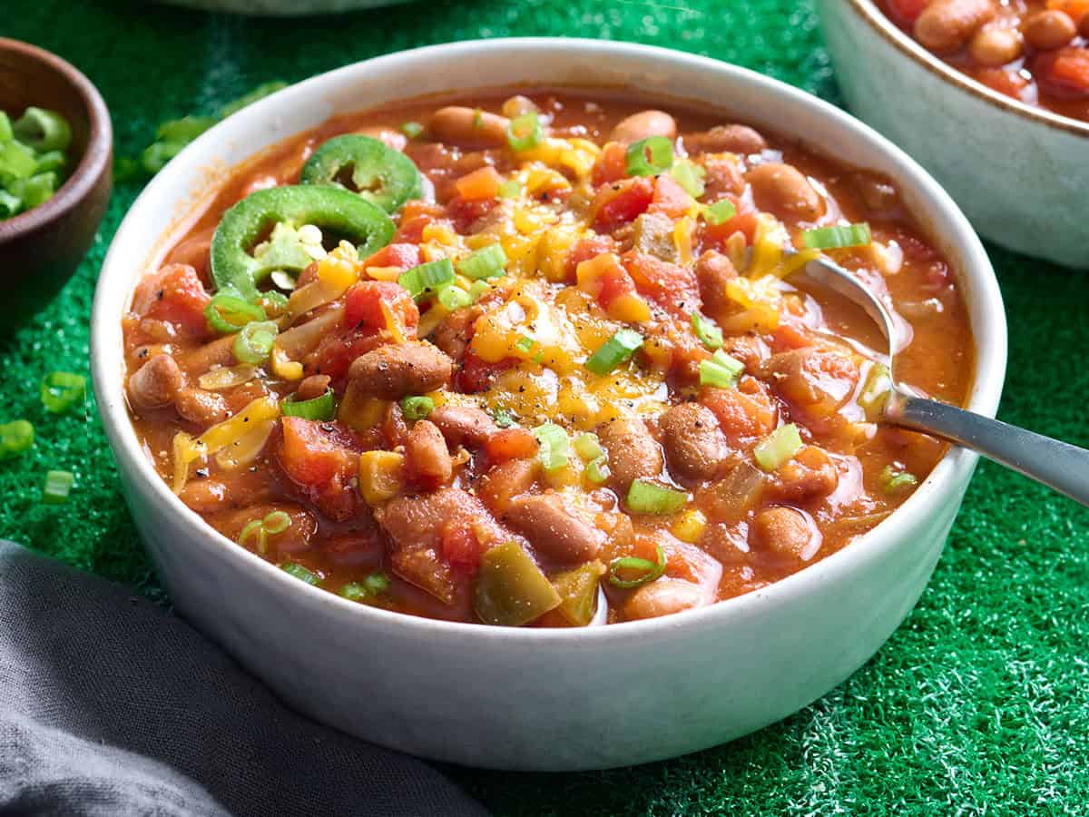 Side view of a bowl of vegetarian chili.