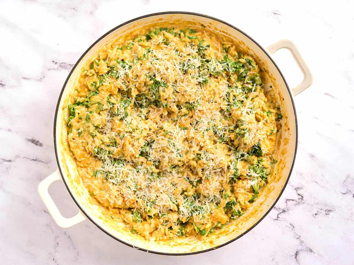 Overhead view of a skillet of creamy butternut squash orzo.