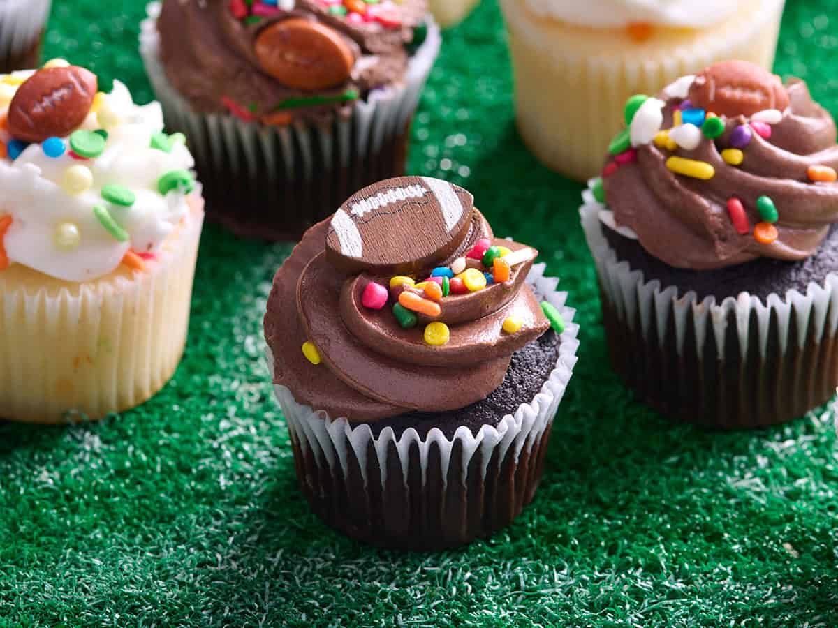 Side view of decorated football cupcakes.