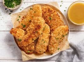 Overhead view of a plate of classic chicken tenders.