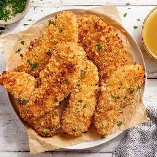 Overhead view of a plate of classic chicken tenders.