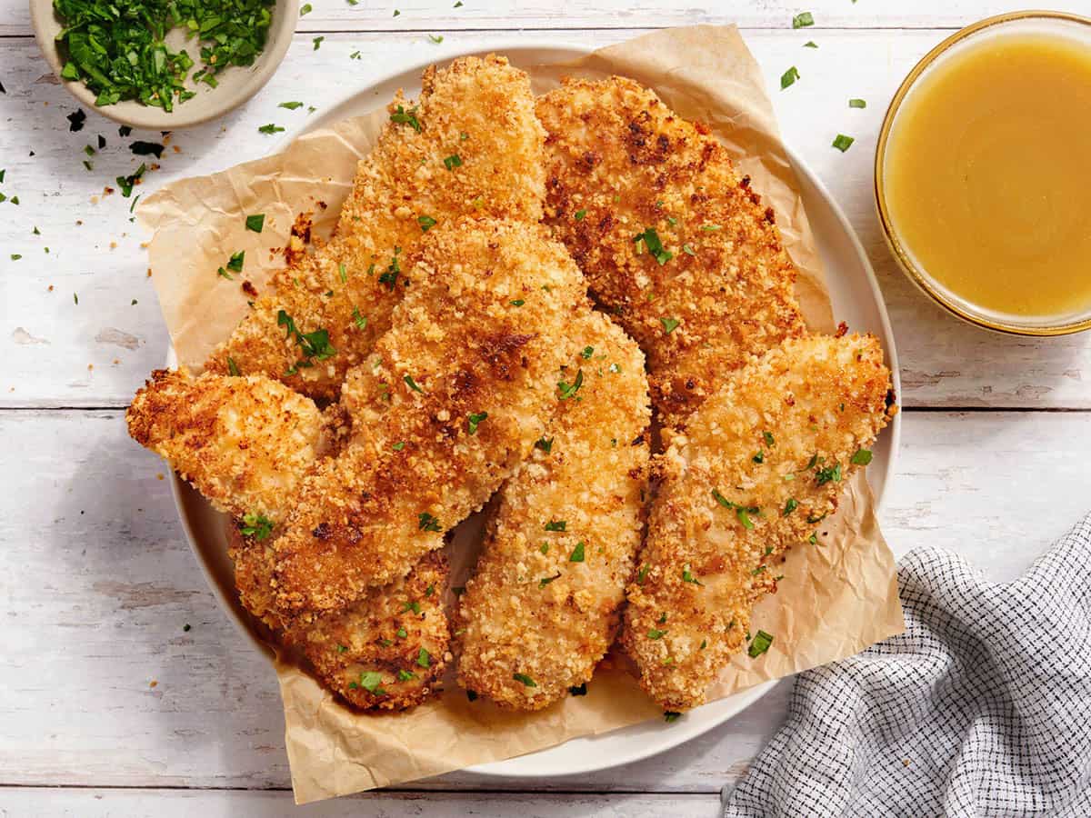 Overhead view of a plate of classic chicken tenders.