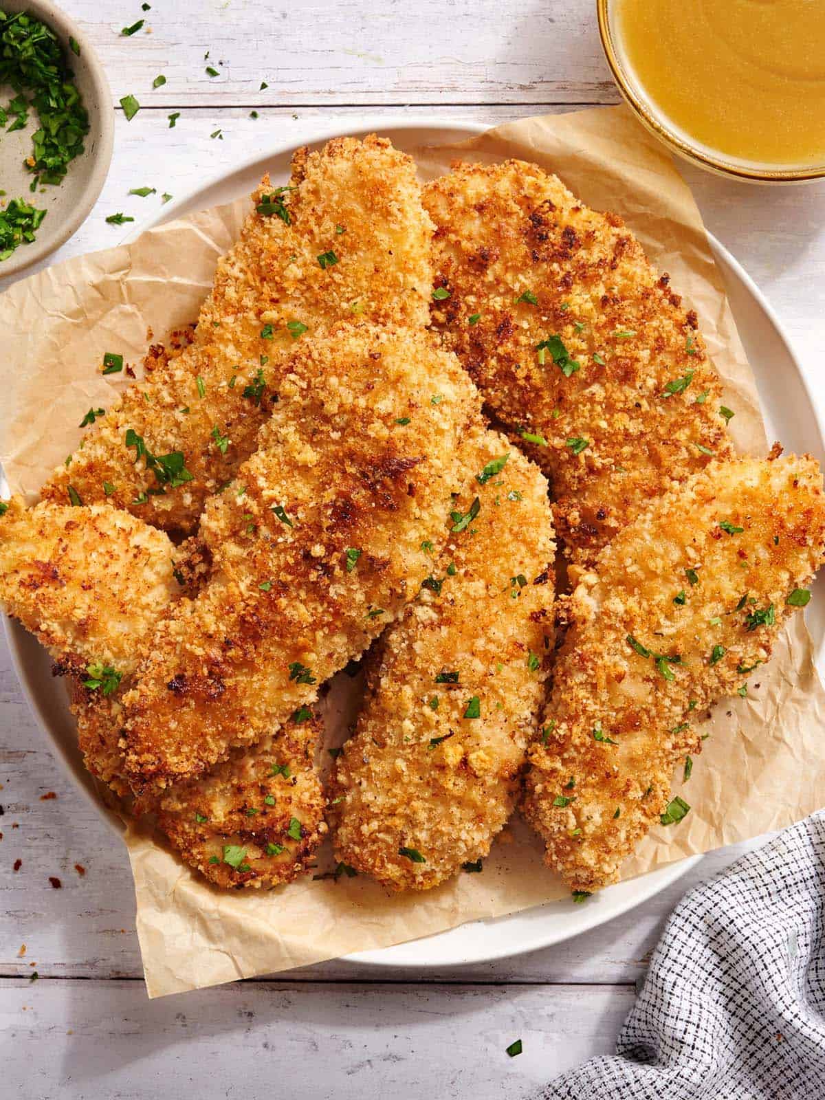 Overhead view of a plate of classic chicken tenders.