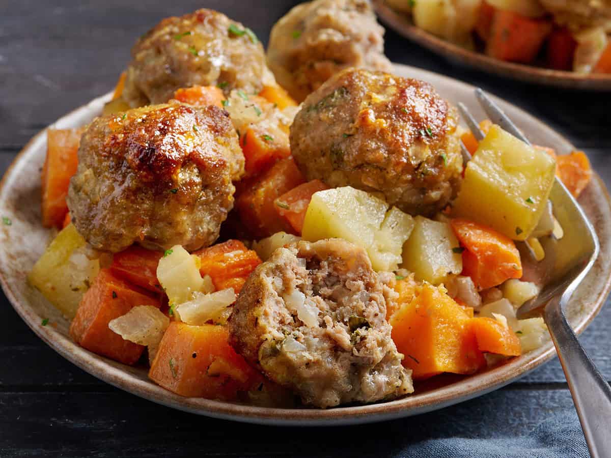 finished sheet pan turkey meatballs and root vegetables on a plate
